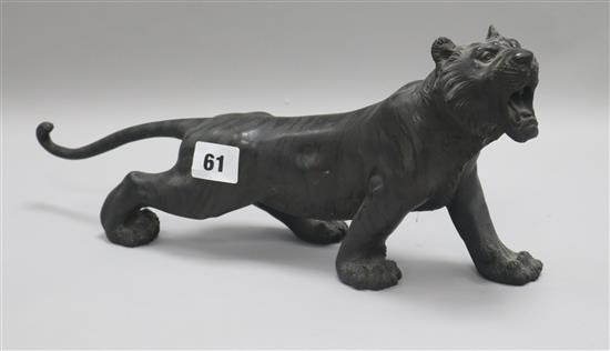 A 19th century Japanese bronze of a roaring tiger Length 35cm.